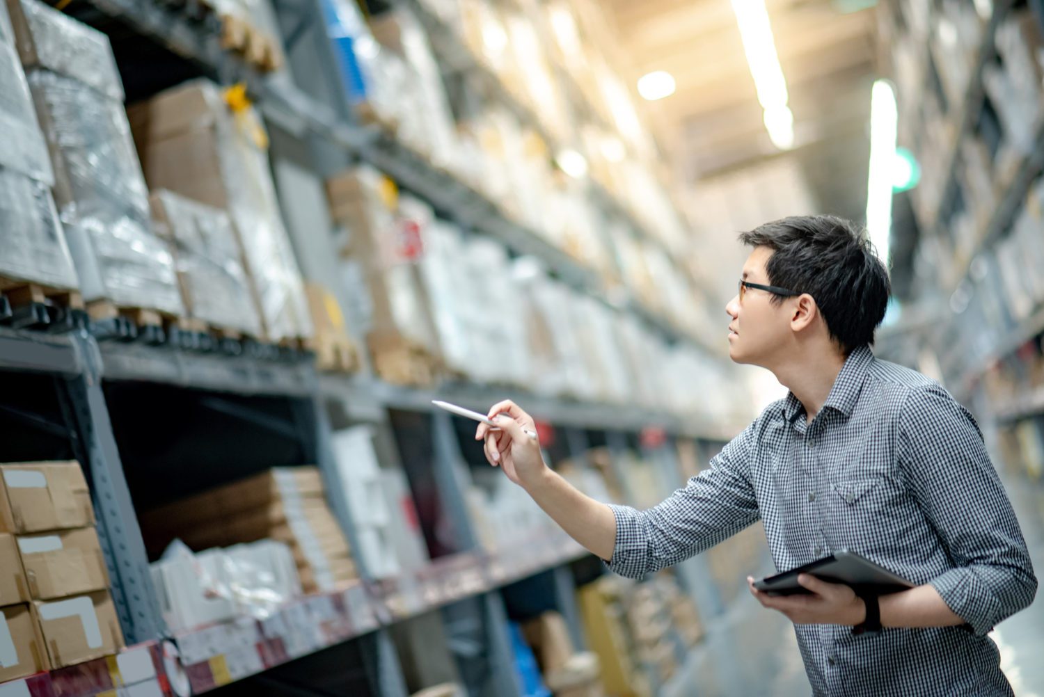 Employee taking inventory in the AMS warehouse