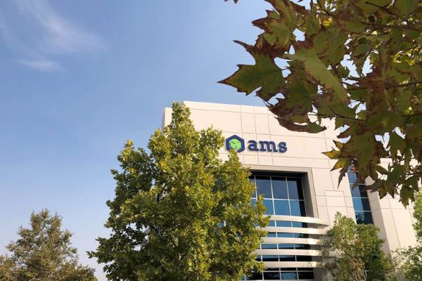 AMS Fulfillment HQ image from outside, seen through trees