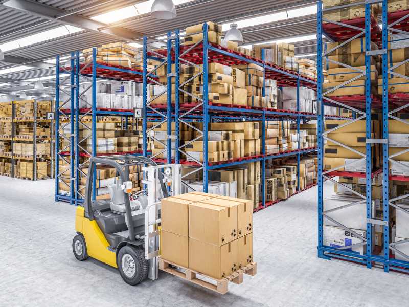 AMS Fulfillment warehouse with shelves full of packages, and a mini fork lift carrying packages. 	