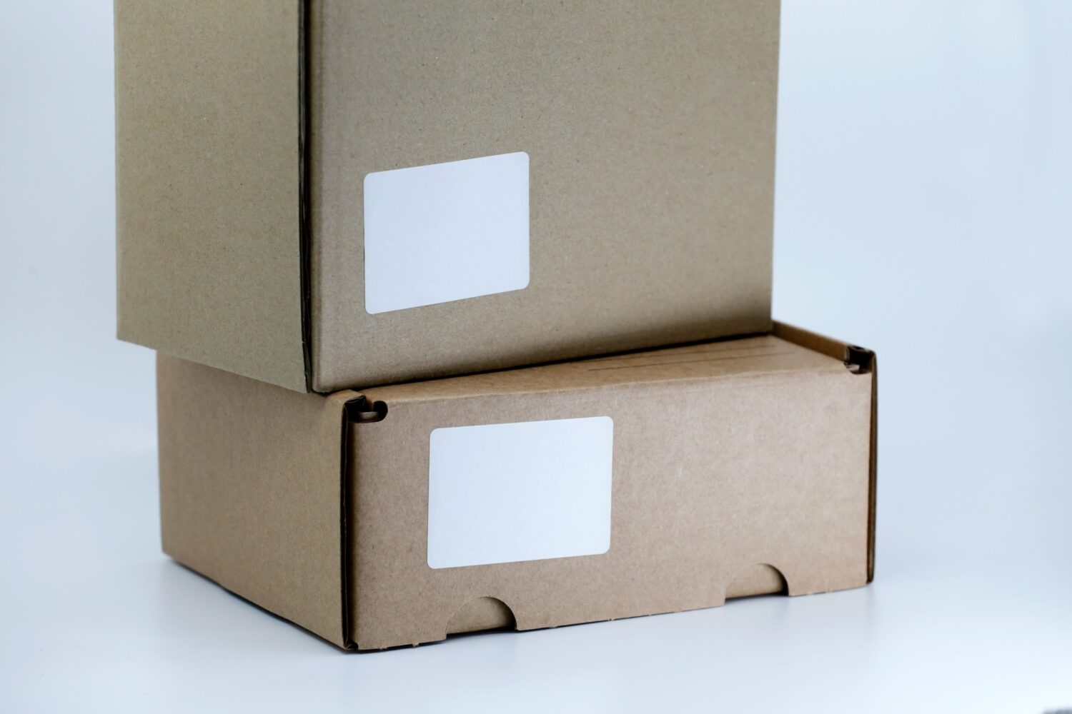 two boxes stack with white labels - AMS Fulfillment