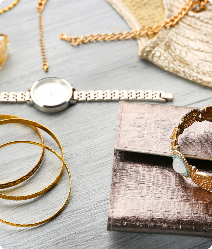 Stock image of various accessories including a watch, wallet, and bracelets.