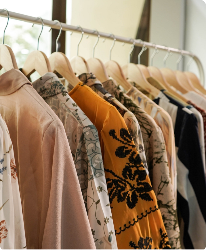 Clothing rack with various shirts.