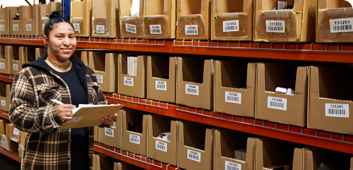 Person keeping track of inventory with SKUs.