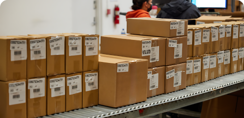 packed boxes sitting on an assembly line.