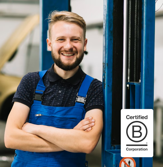 AMS employee leaning against a shelf and smiling