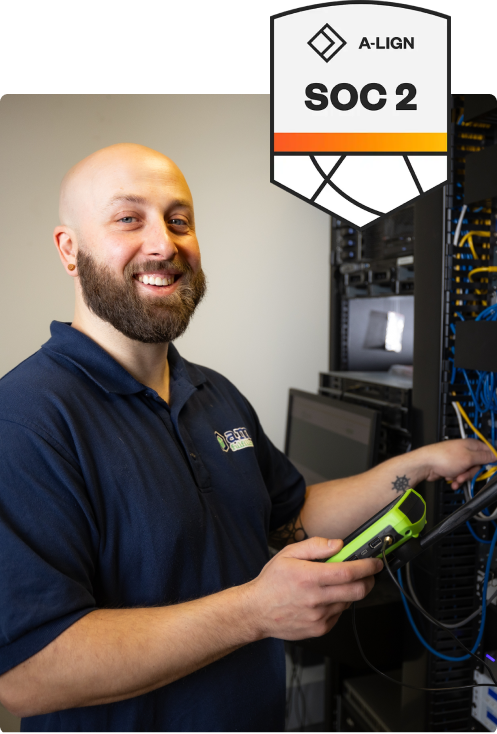 AMS employee holding a scanner and smiling