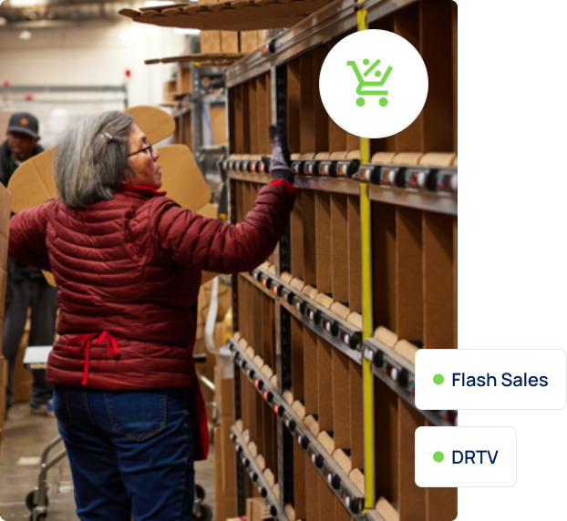 Woman checking shelves in an AMS Fulfillment warehouse.