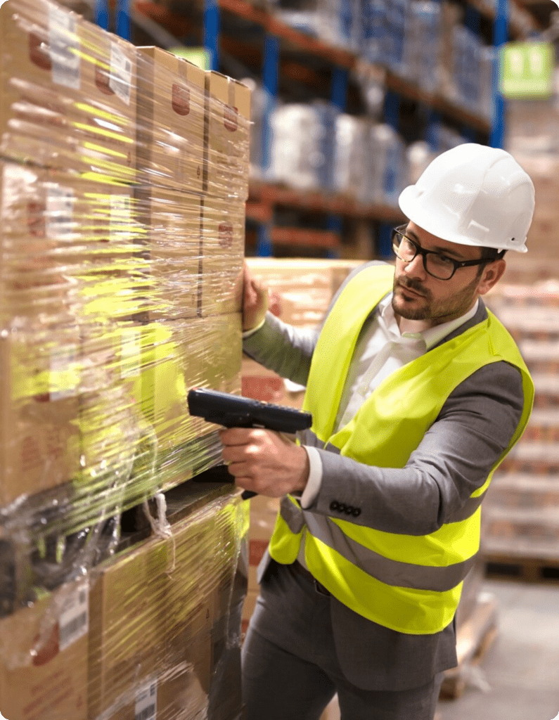 AMS Employee Scanning Boxes in a Warehouse
