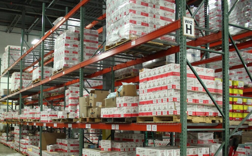 Fulfillment center shelves that are full of products.