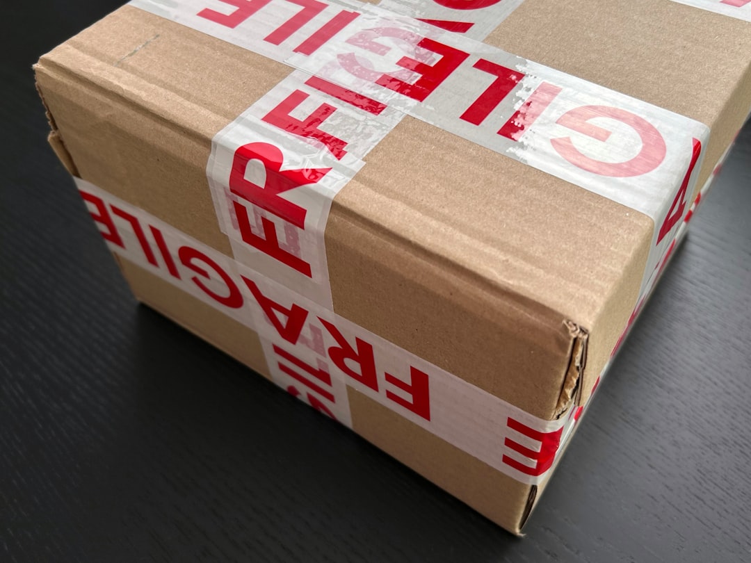 A box is wrapped in tape that says, ‘FRAGILE’ in red letters.